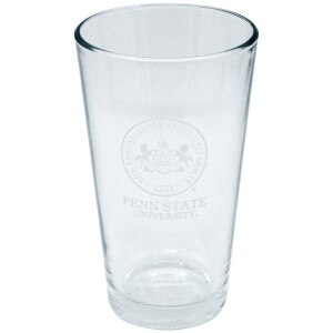 pint glass with etched Penn State University below official seal